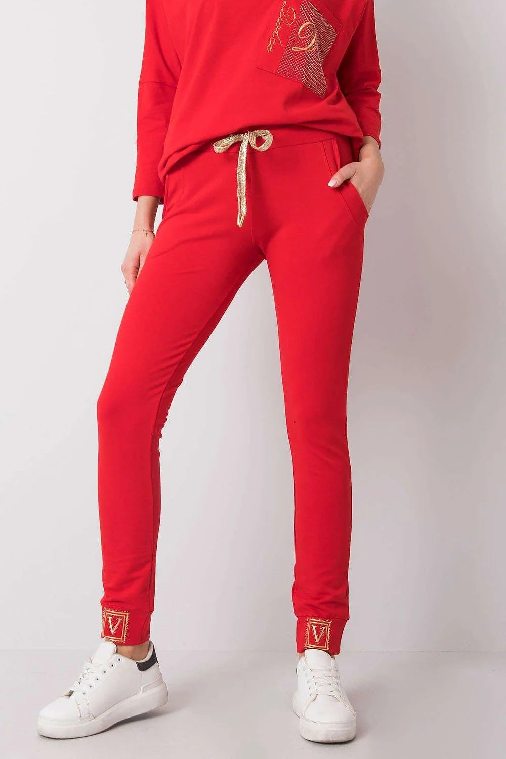 pantalon survêtement femme slim taillebasse fuselé chevilles resserrées rose poudré jersey stretch coton élasthanne poches latérales bande brodée