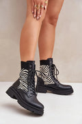 bottines femme audacieuses zébrées cuir écologique noir blanc col côtelé semelle crantée rembourrée talon moyen lacets œillets métalliques