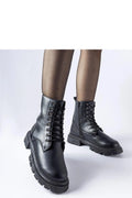 Bottes trappeur Solea femmes cuir noir design robuste style moderne talon plat semelle caoutchouc fermeture éclair