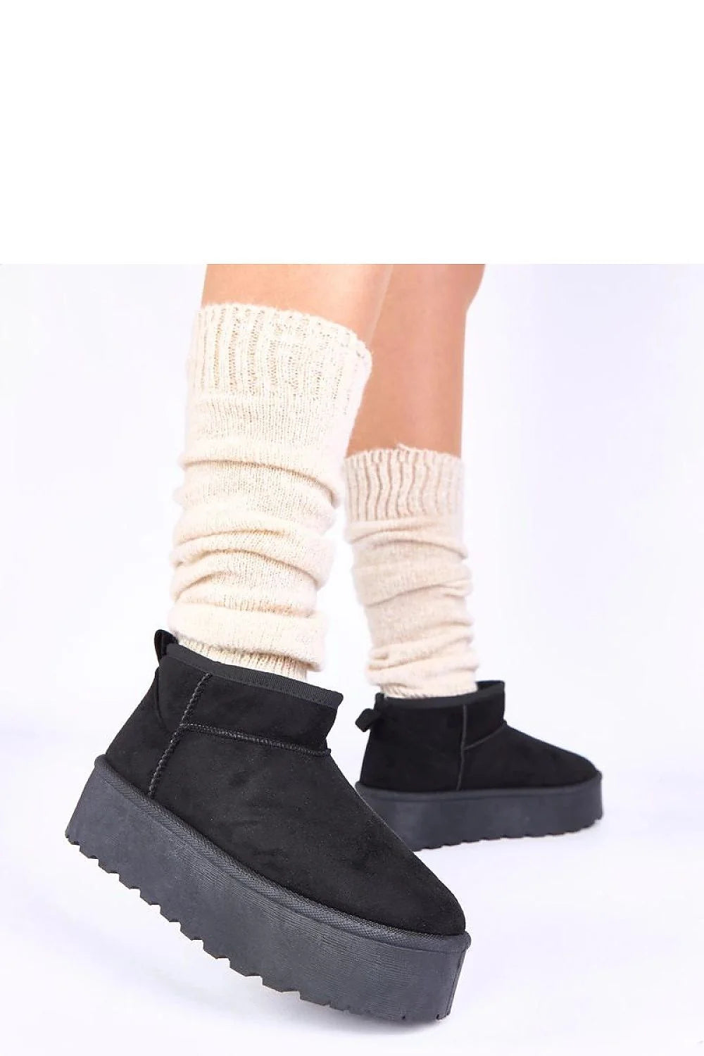 bottes neige noires plateforme fourrure doublure chaude semelle crantée antidérapante suédine slipon cheville profilée confort urbain
