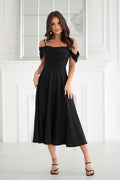 robe soirée noire drapée épaules dénudées bretelles fines col bénitier buste cintré jupe évasée longueur midi fluide polyester