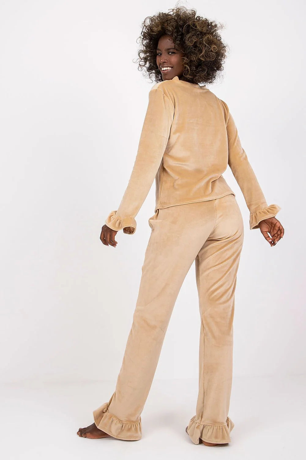 Pyjama set for women in soft beige velour, elegant and comfortable, with ruffled sleeves and waist bow, perfect for lounging at home