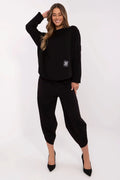 ensemble femme moderne élégant décontracté chic noir maille douce structurée oversize manches longues col rond ourlet asymétrique broderie discrète poches