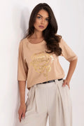 Ensemble mode femme ample t-shirt manches mi-longues beige motif rose doré pantalon pinces taille haute beige clair ceinture noire fine
