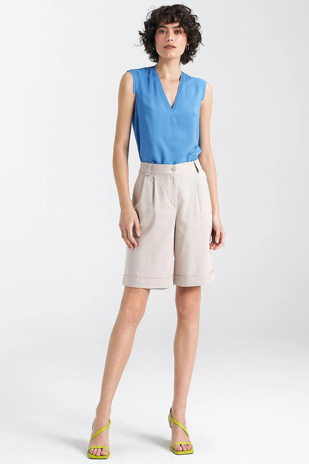 Chemisier sans manches féminin en viscose bleu vif coupe ajustée encolure en V plis délicats épaules soignées
