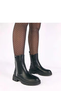 Bottines Chelsea noires cuir synthétique lisse bout arrondi empiècements élastiques latéraux fermeture éclair décorative extérieure semelle plateforme crantée antidérapante chunky