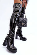 Bottes à talons audacieuses cuir verni noir haute tige genou montante plateforme détails métalliques femme