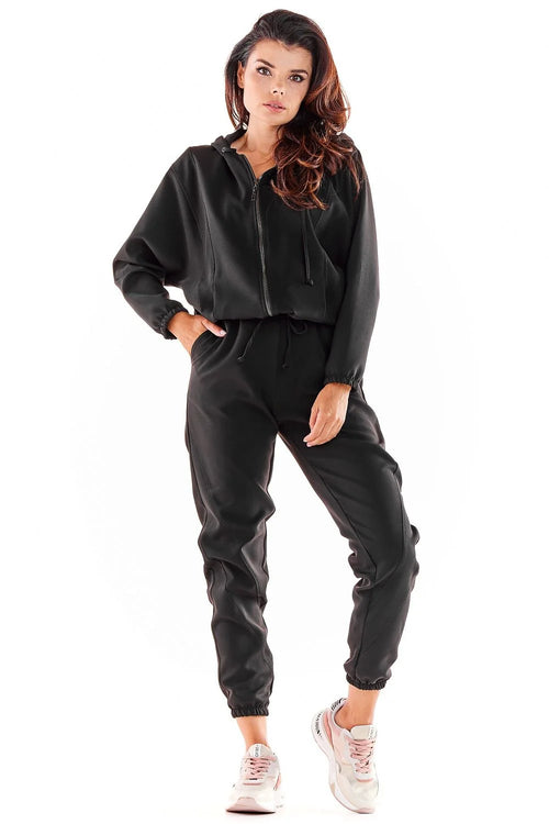 Survêtement polyester élasthanne noir veste capuche zippée pantalon jogger taille élastique coupe ample manches longues col rond style