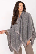 poncho femme acrylique maille jacquard gris anthracite motifs floraux étoiles rose pâle coupe oversize drapée asymétriques bords contrastés