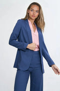 Costume pour femme élégant tailleur pantalon bleu profond coupe structurée blazer sans boutons épaulettes soulignées