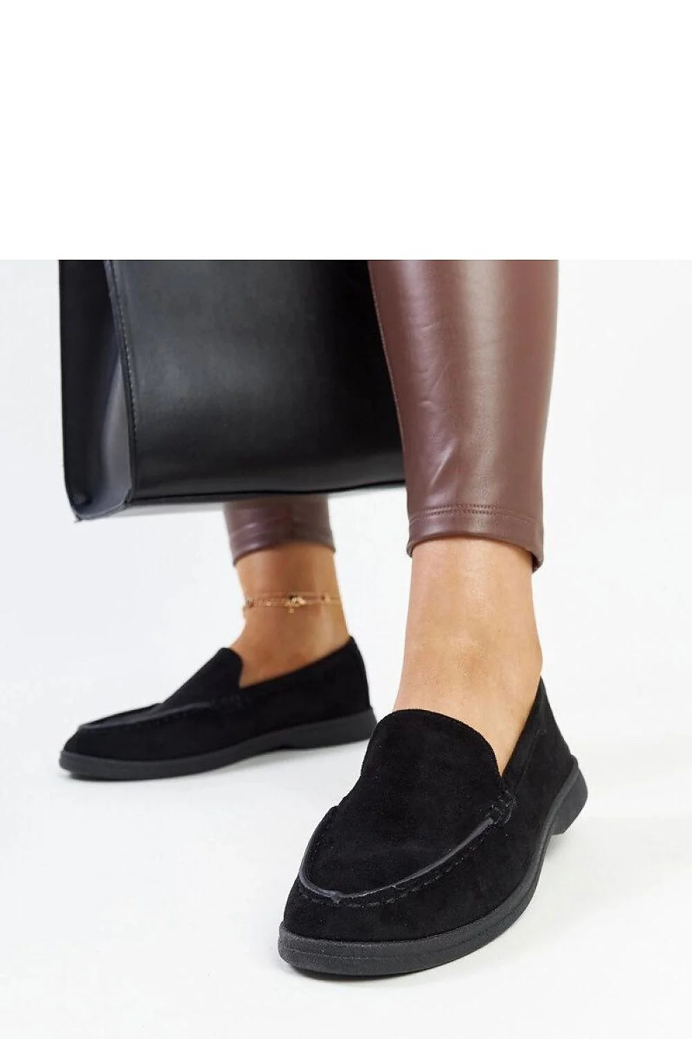 Moccasins élégants pour femmes en daim noir design intemporel confortable talon plat semelle caoutchouc