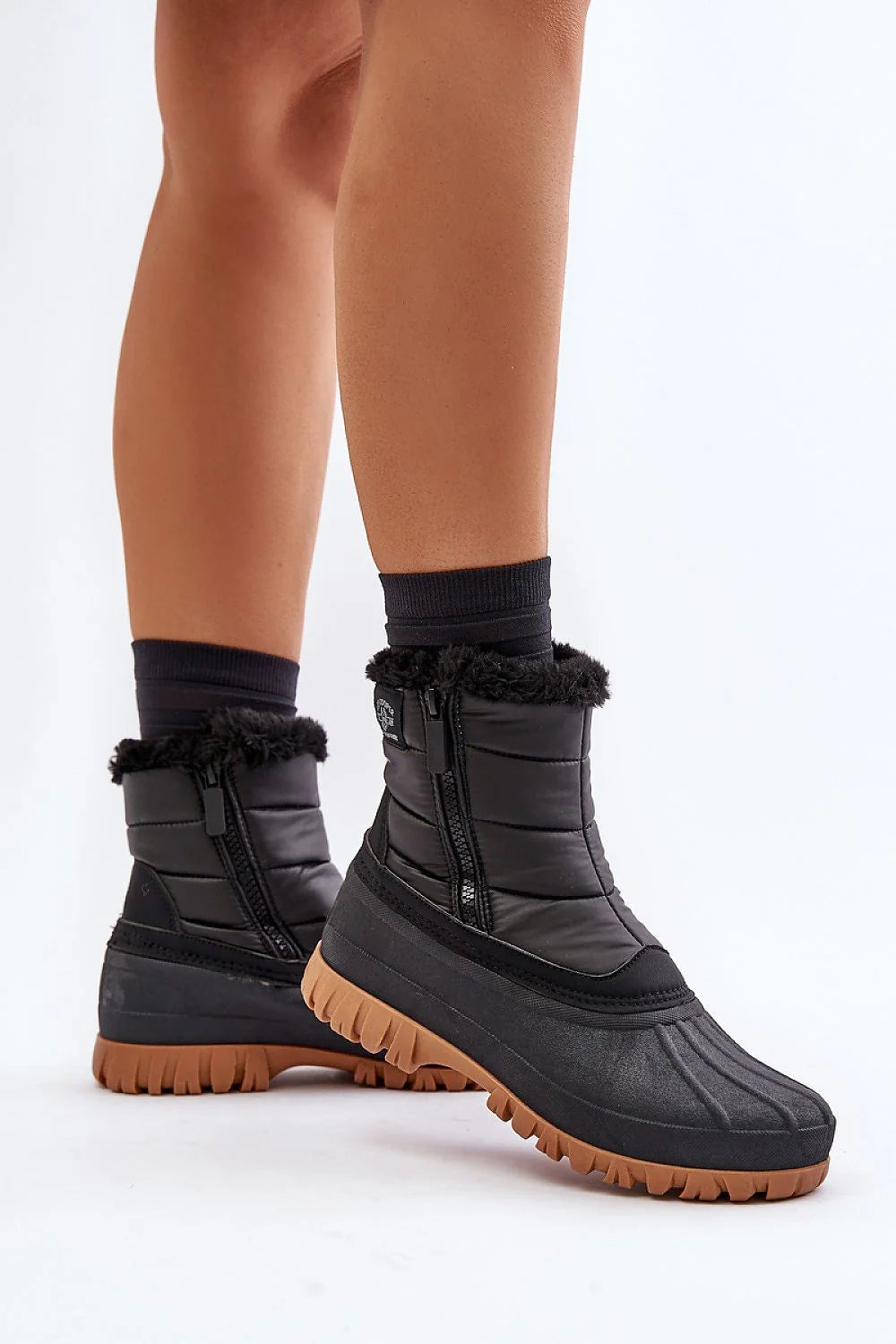 Bottes de neige Lee Cooper pour femmes design moderne fonctionnel hiver 2023 isolation thermique fourrure synthétique matelassé noir marron