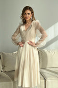 Robe de soirée élégante longue manches longues dos nu sérapés beige clair polyester viscose