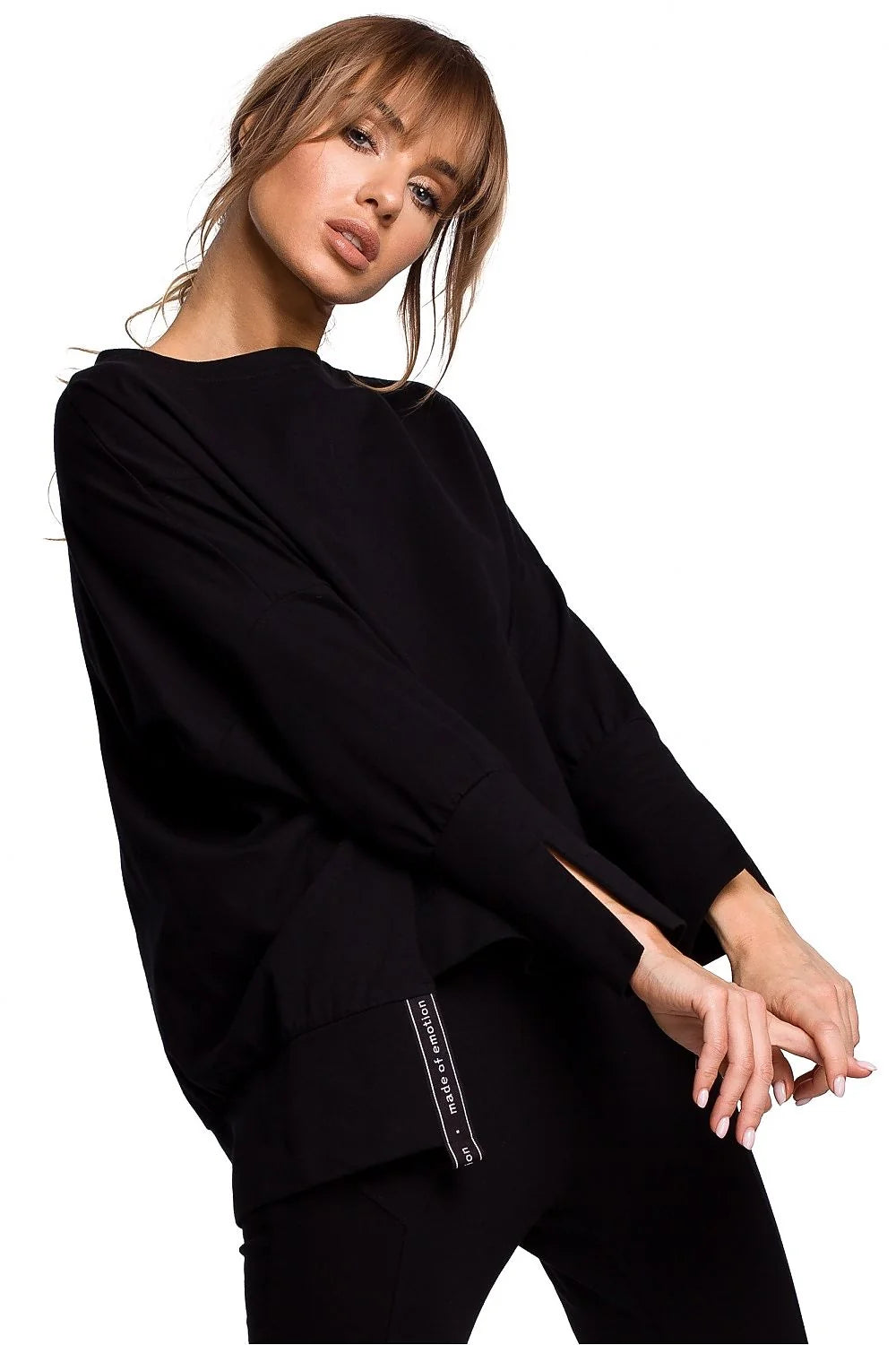 Sweatshirt ample coton noir moderne confortable manches longues fentes poignets pour femme décontractée élégante