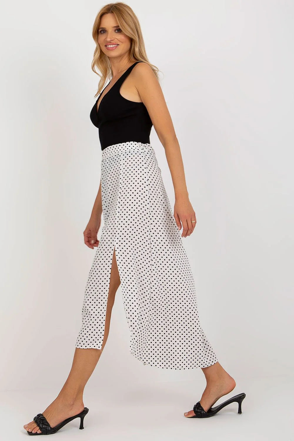 Robe élégante deux-en-un longue asymétrique noire et blanche pois noirs décolleté V sans manches jupe fendue taille ajustable femme