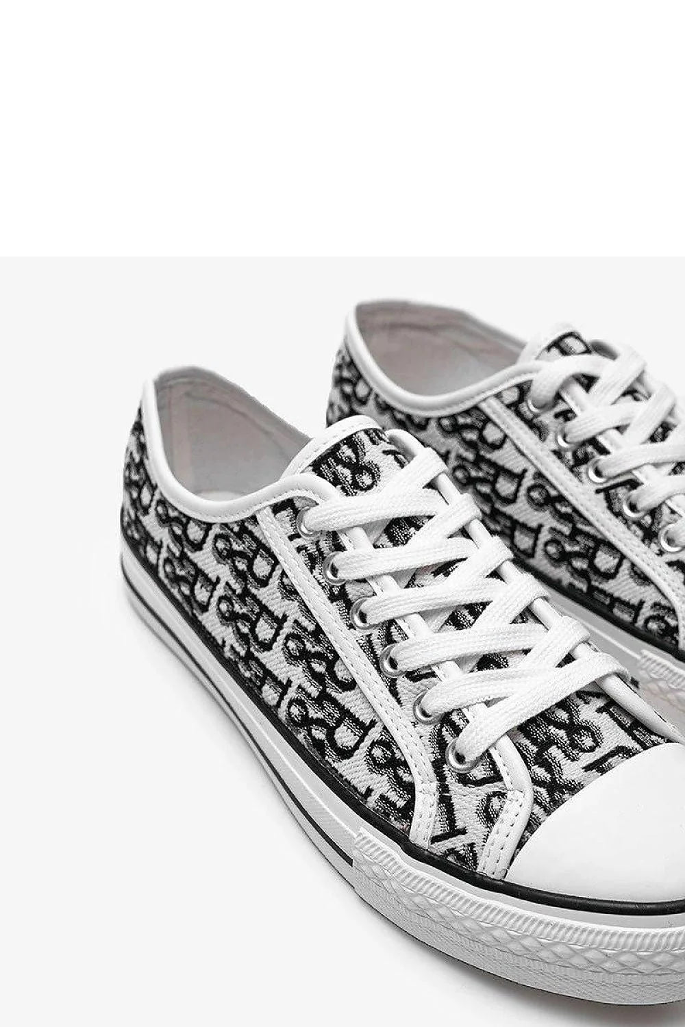 Baskets pour femme modernes design épuré motif graphique blanc noir lacets ajustables tige basse semelle caoutchouc respirante confortable style casual urbain été automne hiver
