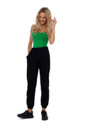 Pantalon survêtement Moe féminin en coton polyester coupe ample taille élastique poches latérales sneakers noires débardeur ajusté vert vif