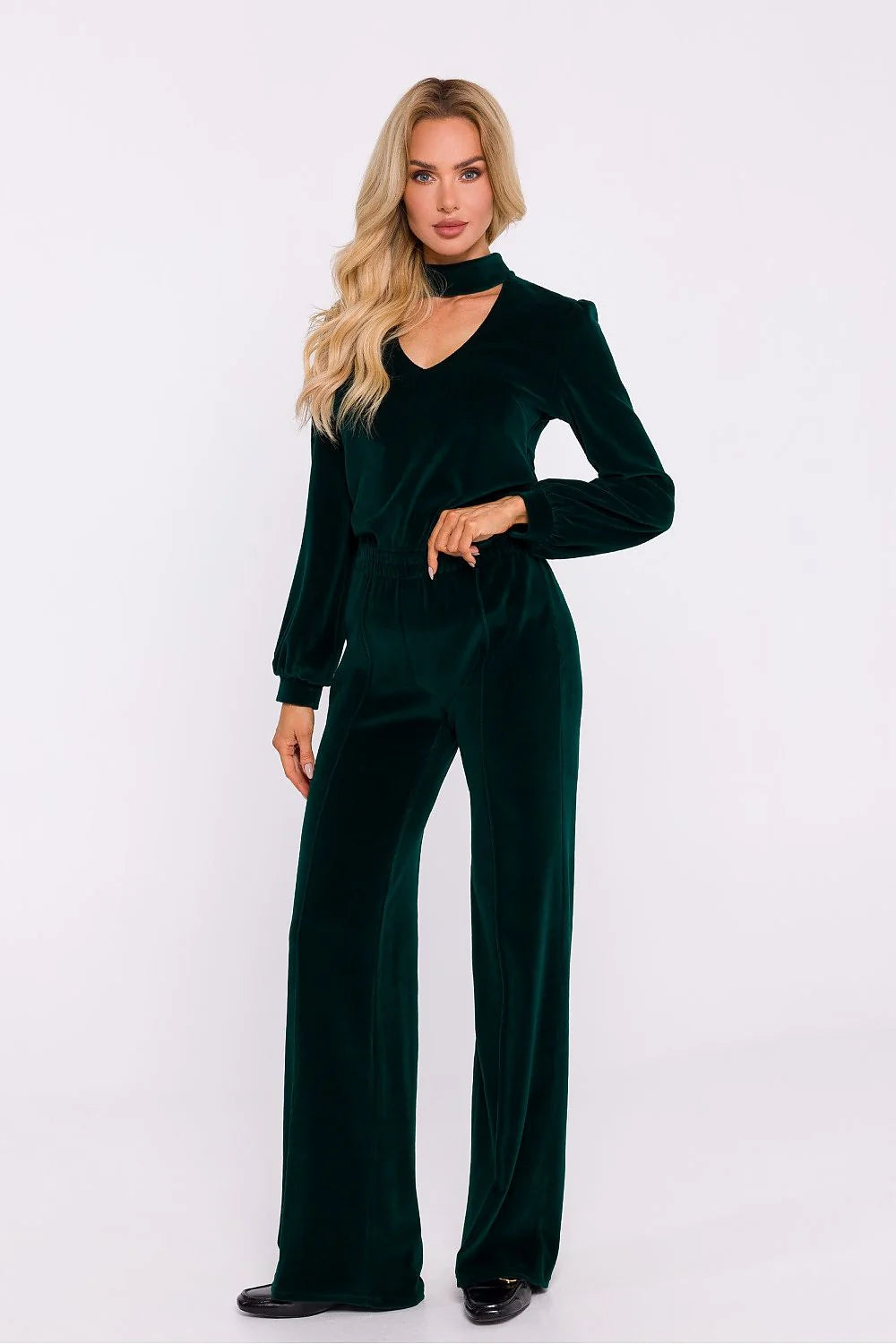 Ensemble femmes haut et pantalon velours vert émeraude profond coupe élégante manches longues bouffantes taille haute