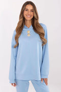 ensemble décontracté femme contemporain minimaliste manches longues pantalon assorti bleu ciel dorés détails molleton doux extensible coupe ample