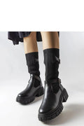 Bottes cuissardes en cuir noir moderne avec semelle épaisse pour style urbain et tendance