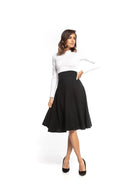 Jupe midi noire évasée coton style élégant intemporel sophistiqué taille haute mode féminine chic