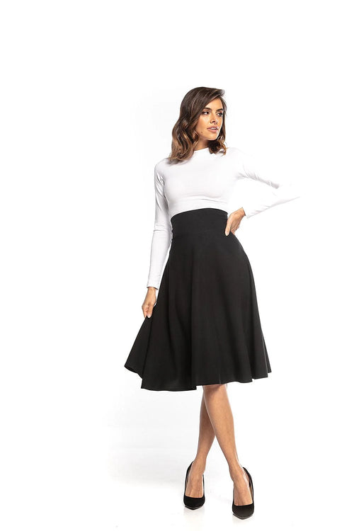 Jupe midi noire évasée coton style élégant intemporel sophistiqué taille haute mode féminine chic