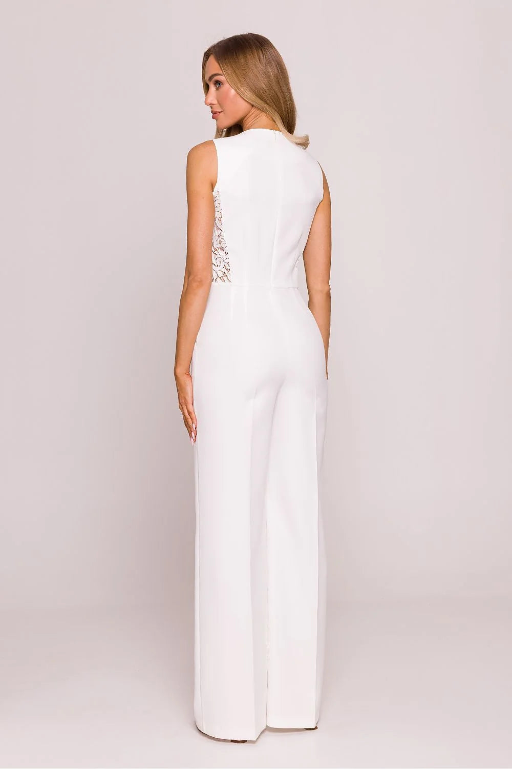 Combinaison féminine élégante sans manches dentelle blanche jambes larges taille ajustée coupe moderne combi