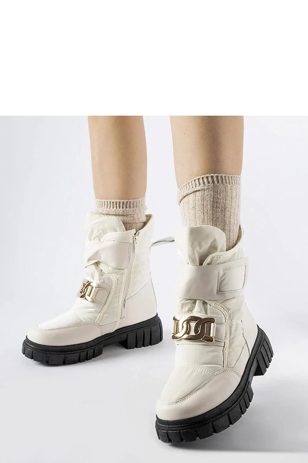 Bottes de neige Solea pour femmes style moderne élégant couleur beige cassé matériau synthétique détails dorés confort protection froid hiver