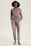 ensemble survêtement deux pièces sweat manches longues poignets côtelés pantalon jogger poches latérales taille élastiquée cordon coulissant velours rose poudré