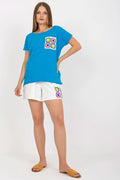 Ensemble Fancy coton bleu blouse manches courtes col rond coupe ample poche motif floral short blanc droite multicolore