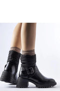 bottes cuir noir matelassé femme zippée latérale semelle massive crantée talon carré sangle boucle métallique confortable urbaine élégante