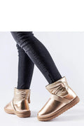 Bottines enneigées dorées métalliques moderne design compact silhouette profilée semelle caoutchouc élastique sangle femmes urban style hiver