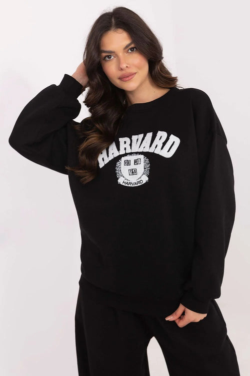 Sweatshirt femme Harvard ample couleur noire coton polyester longues manches encolure ronde logo université manches bouffantes côtelé