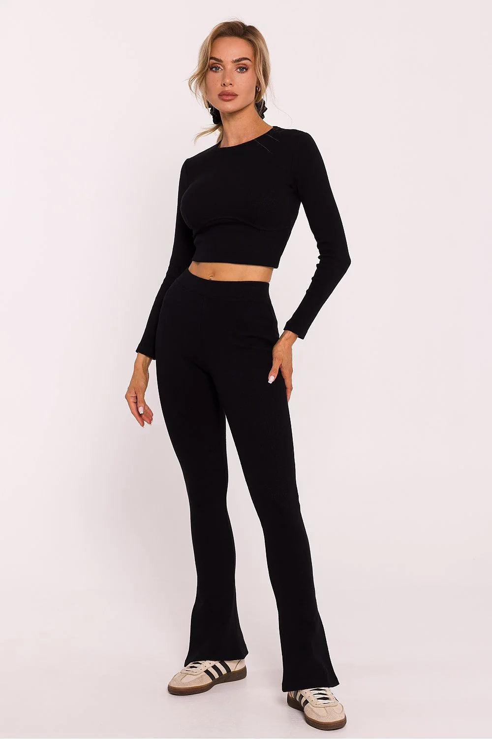 Leggings longues taille élastique en coton stretch noir pour femmes, coupe ajustée, fentes latérales, style moderne et confortable