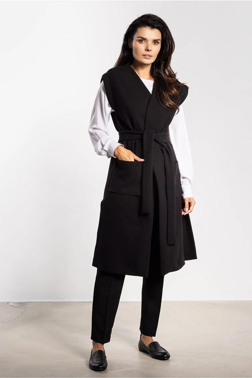 gilet long femme velours côtelé doux noir coupe droite midi ceinture nouée poches plaquées fentes latérales finition soignée production polonaise