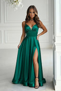 robe soirée longue vert émeraude satin brillant bustier fines bretelles décolleté plongeant transparent taille cintrée jupe fluide fente haute cuisse