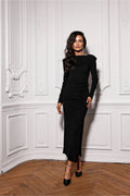 Robe de soirée élégante longue manches longues épaules structurées couleur noire tissu extensible fente sur la jambe