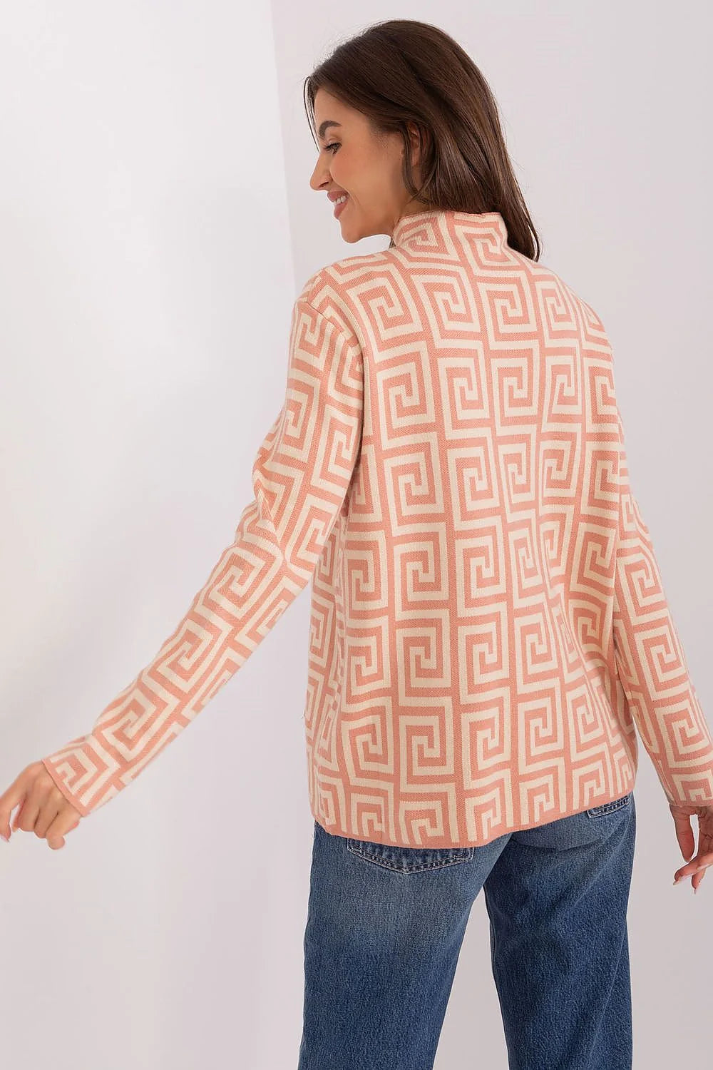 Haut féminin motif géométrique manches longues col montant zips latéraux rose pâle blanc crème