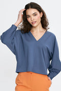 chemisier Nife oversize encolure V manches longues boxy courte emmanchures tombantes couture centrale décorative bleu ardoise fluide léger ourlet droit