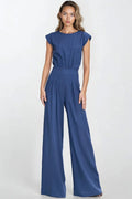 Combinaison élégante pour femme en rayonne et lin, bleu profond, style moderne, coupe ajustée à la taille, pantalon large, épaules structurées, occasion semi-formelle