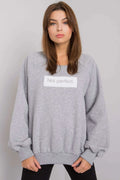 sweatshirt femme oversize gris clair molletonné doux manches longues raglan col rond côtelés poignets imprimé Not perfect brodé