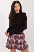 chemisier maille côtelée noir col montant manches longues bouffantes poignets allongés coupe ajustée stretch confortable élégant