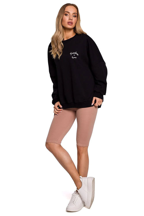 sweatshirt oversize coton molleton noir col rond manches longues côtelés broderie blanche short cycliste beige extensible élasthanne ajusté baskets blanches