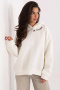 sweatshirt femme oversize écru molleton doux coupe loose capuche côtelée manches longues épaules tombantes broderie marron message amour confortable casual