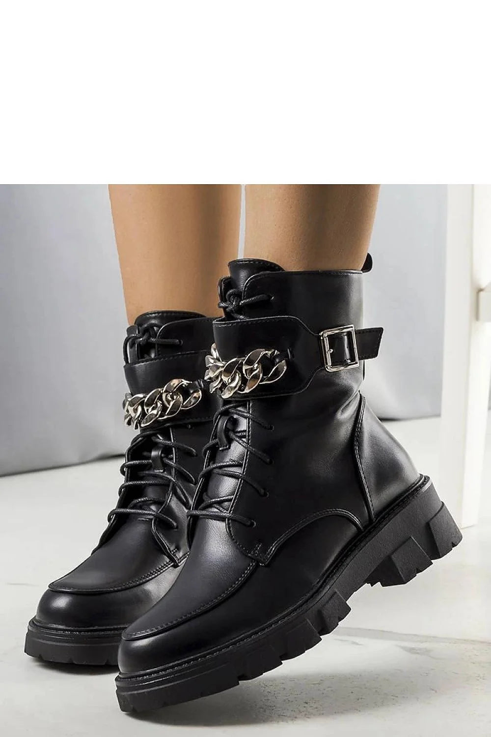 Bottes militaires noires en cuir synthétique avec chaîne métallique, lacets, semelle crantée et doublure fourrure imitation femme