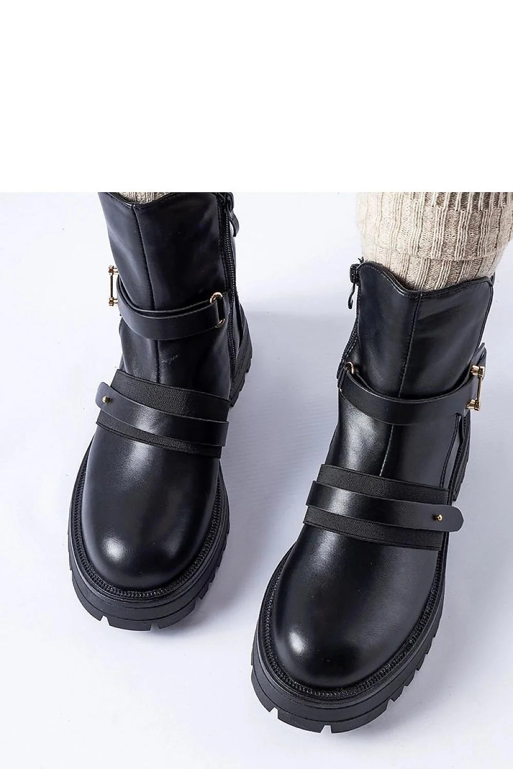 Bottines femmes design moderne élégant cuir noir lisse fermeture éclair métal doré lanières boucles semelle épaisse crantée maintien cheville
