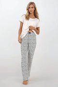 Pyjama pour femme en coton confortable et moderne, deux pièces, manches courtes, motifs abstraits, pantalon large, idéal pour détente
