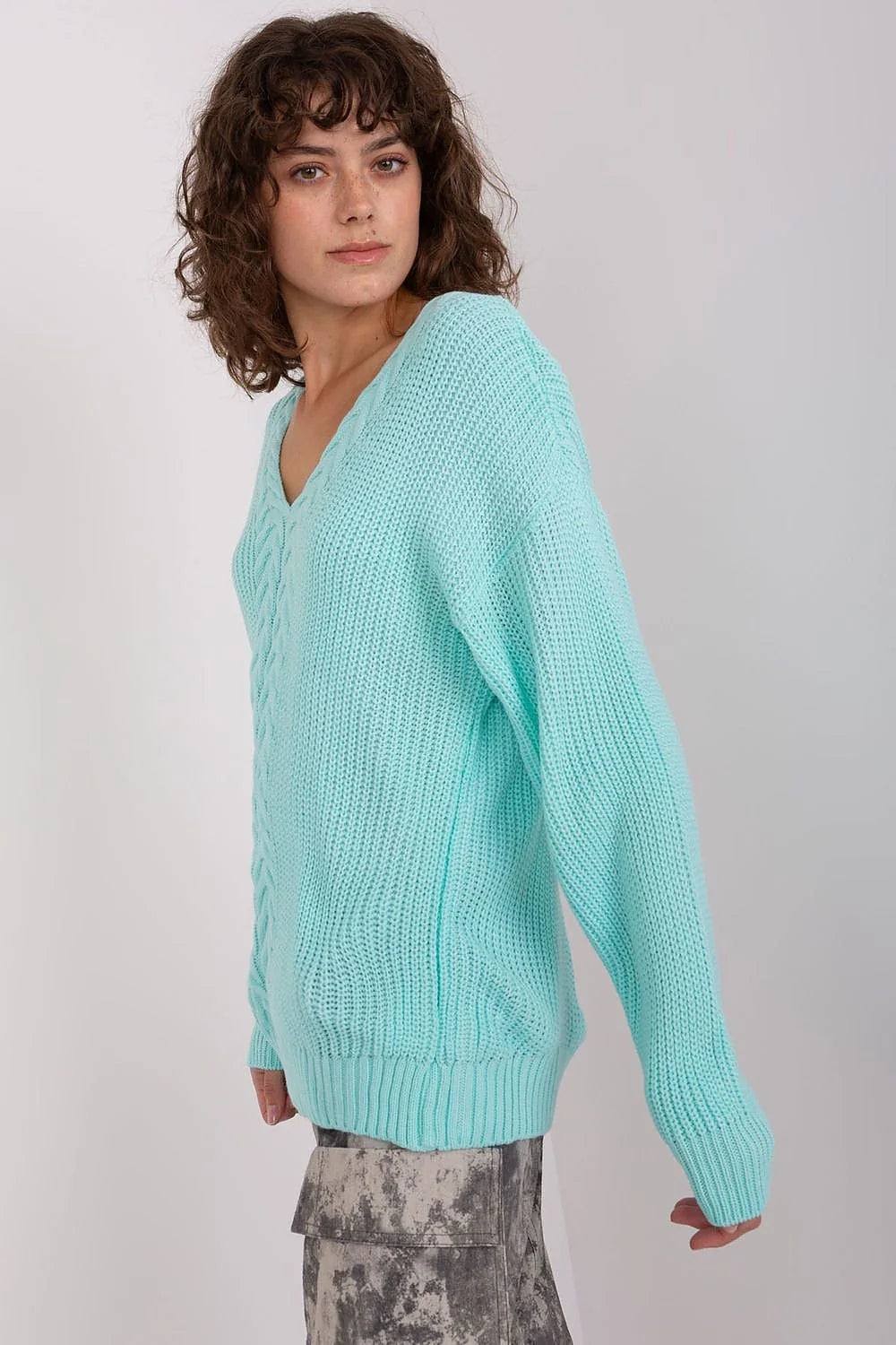 Pull maille femme design twisté turquoise pastel encolure V profond manches longues côtelé casual chic