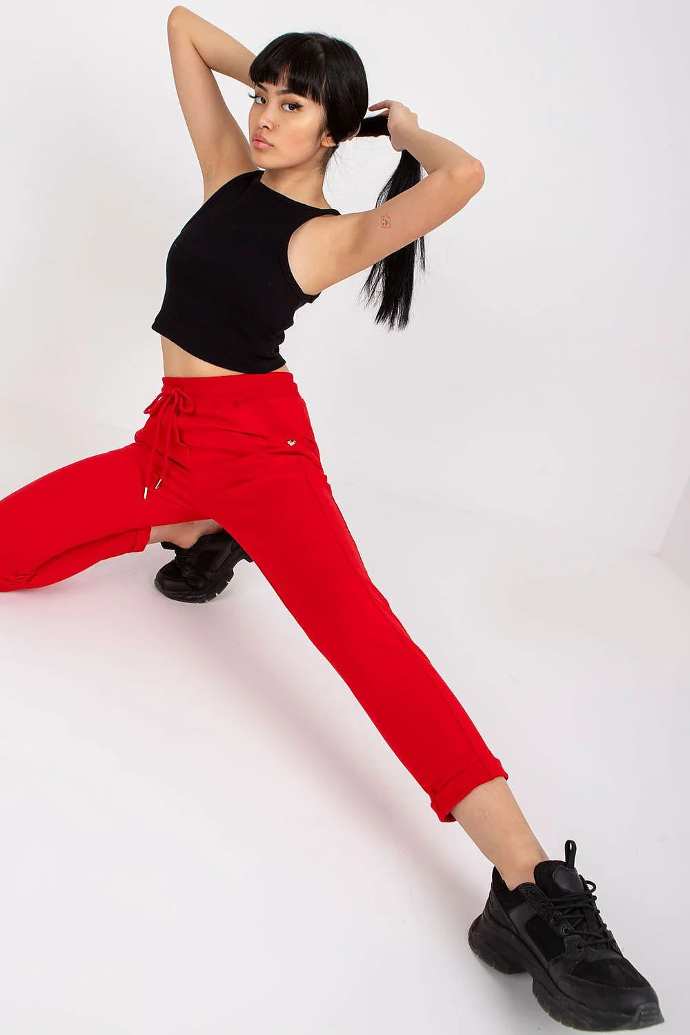 pantalon survêtement femme fuchsia vif taille haute élastique cordon serrage embouts métalliques slim fuselé cheville poches latérales stretch