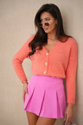 Cardigan La Balancia classique maille moelleuse corail boutons nacré coupe ajustée manches longues décolleté V
